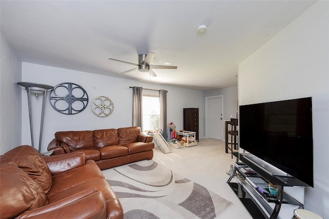 living room featuring a ceiling fan and light colored carpet