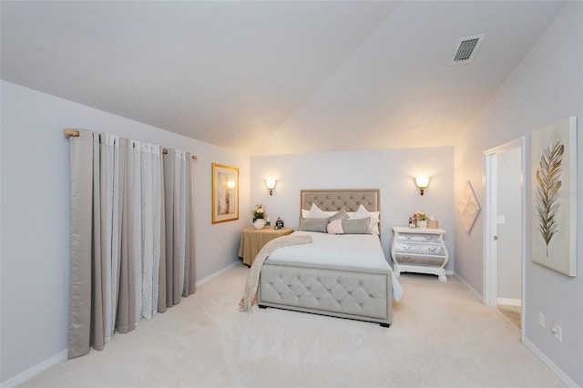 carpeted bedroom with vaulted ceiling