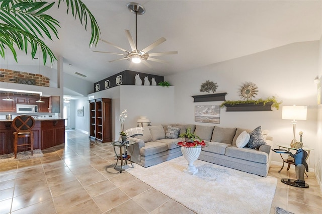 living room featuring ceiling fan, high vaulted ceiling, and light tile patterned floors