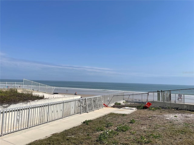 property view of water featuring fence