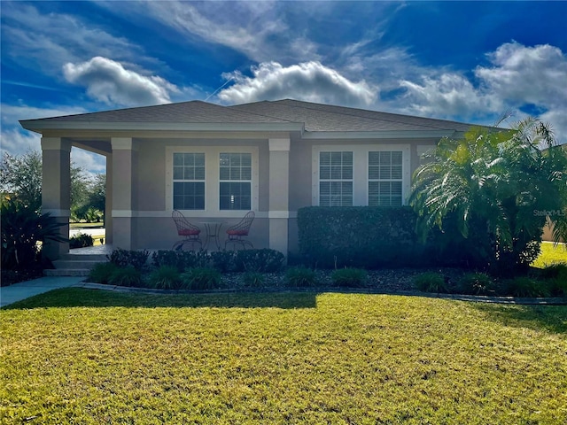 view of property exterior with a lawn