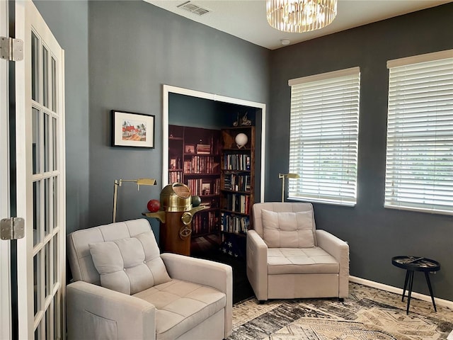 living area with a notable chandelier