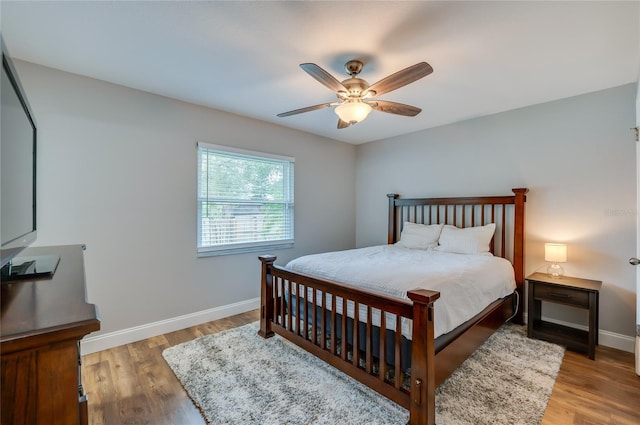 bedroom with hardwood / wood-style flooring and ceiling fan