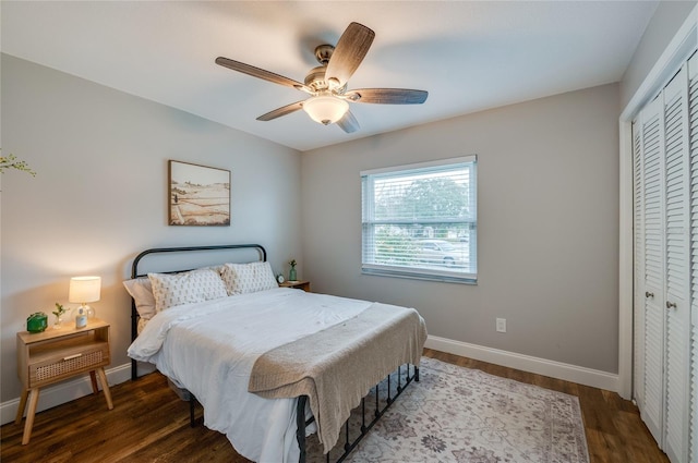 bedroom featuring hardwood / wood-style flooring, a closet, and ceiling fan