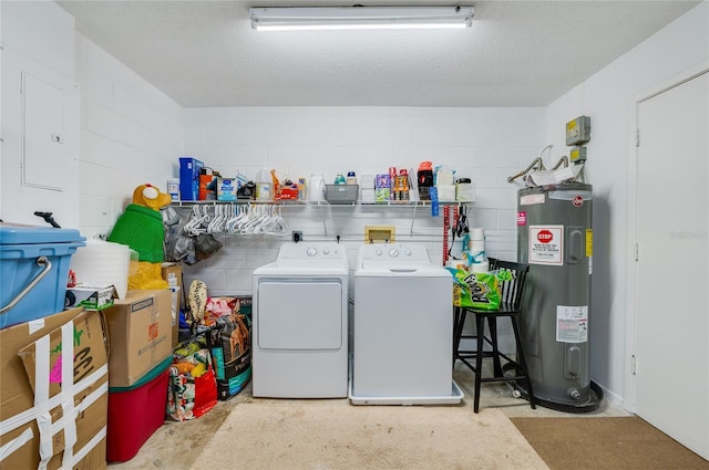 clothes washing area featuring electric water heater, a textured ceiling, independent washer and dryer, and electric panel