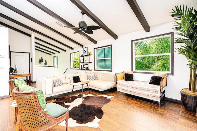 living room featuring vaulted ceiling with beams, wood-type flooring, a healthy amount of sunlight, and ceiling fan