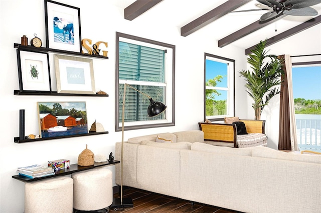 living room with lofted ceiling with beams, dark wood-type flooring, and ceiling fan