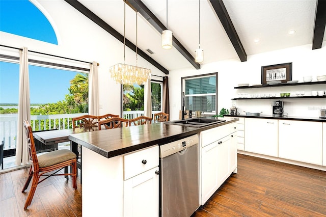 kitchen featuring dishwasher, hanging light fixtures, vaulted ceiling with beams, white cabinets, and a kitchen island