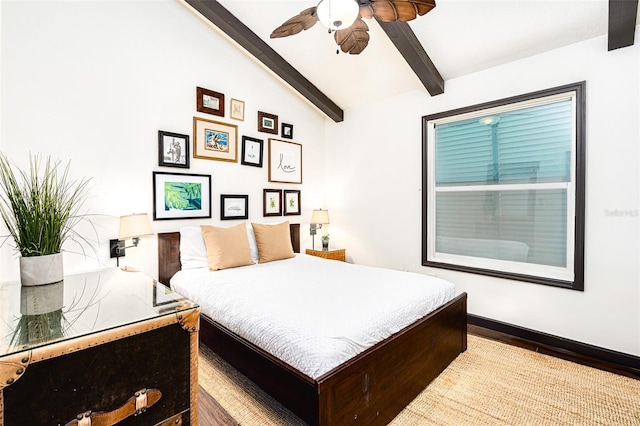 bedroom with lofted ceiling with beams and ceiling fan