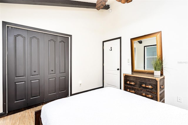 bedroom featuring hardwood / wood-style flooring and a closet