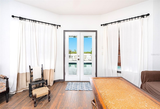 entryway with dark hardwood / wood-style floors and french doors