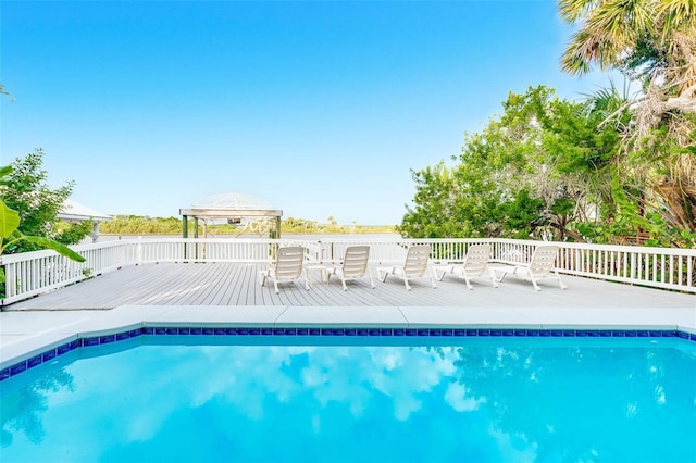 view of pool with a gazebo and a deck