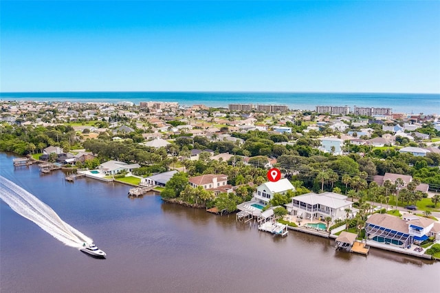 birds eye view of property featuring a water view