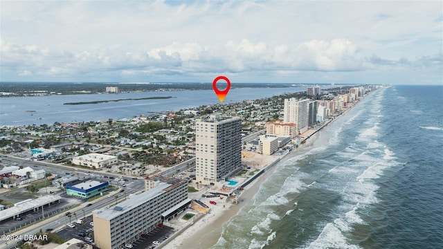 drone / aerial view with a water view and a view of the beach