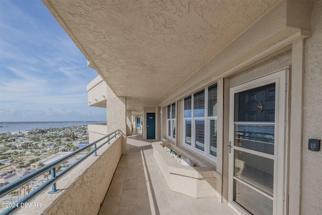 balcony featuring a water view