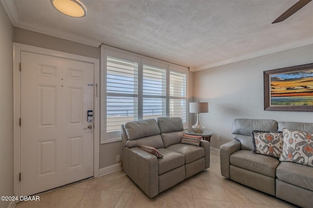 tiled living room with crown molding and a textured ceiling