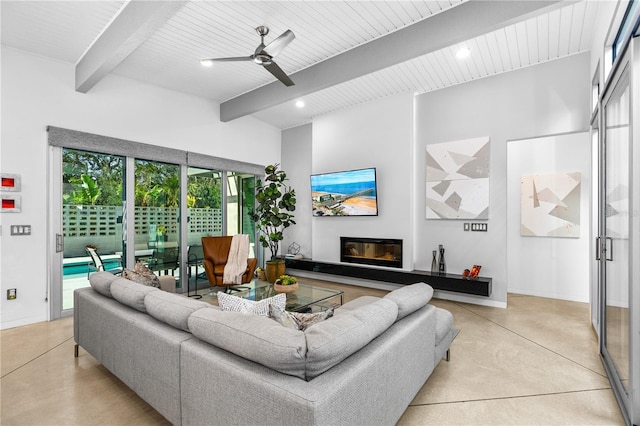 living room with beam ceiling and ceiling fan