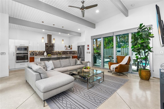 living room featuring beamed ceiling and ceiling fan