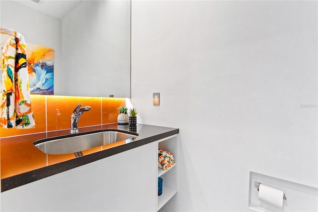 interior space with sink and white cabinets