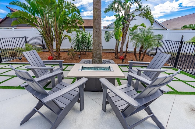 view of patio / terrace featuring an outdoor fire pit