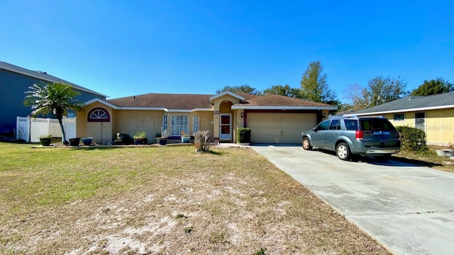 ranch-style house with a garage and a front lawn