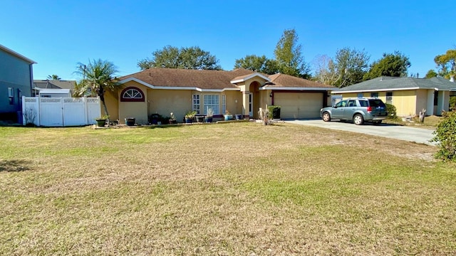 ranch-style house featuring a garage and a front lawn