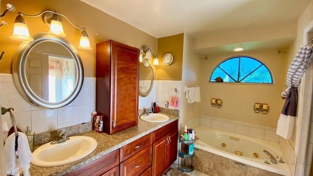 bathroom with vanity, a relaxing tiled tub, and tile walls