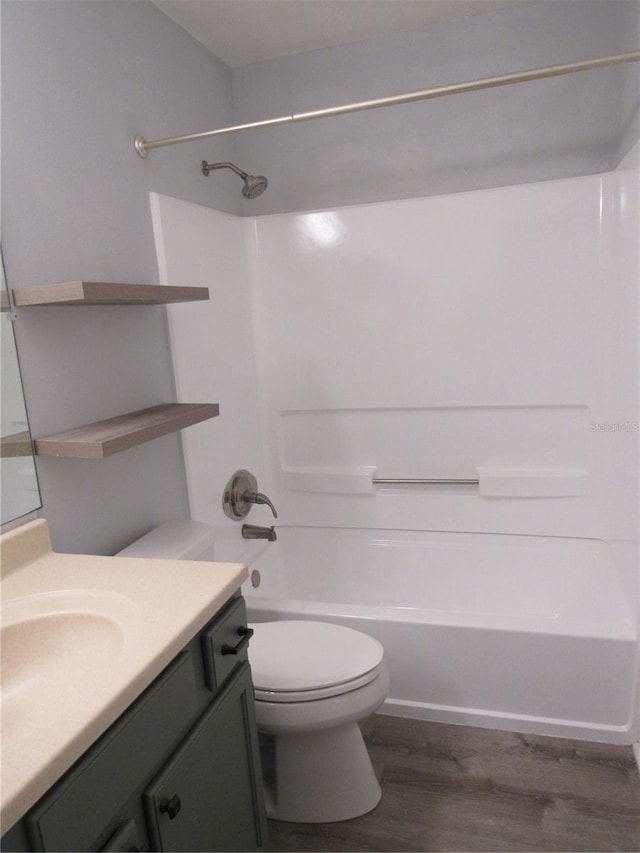 full bathroom featuring vanity, toilet, shower / bathing tub combination, and wood-type flooring