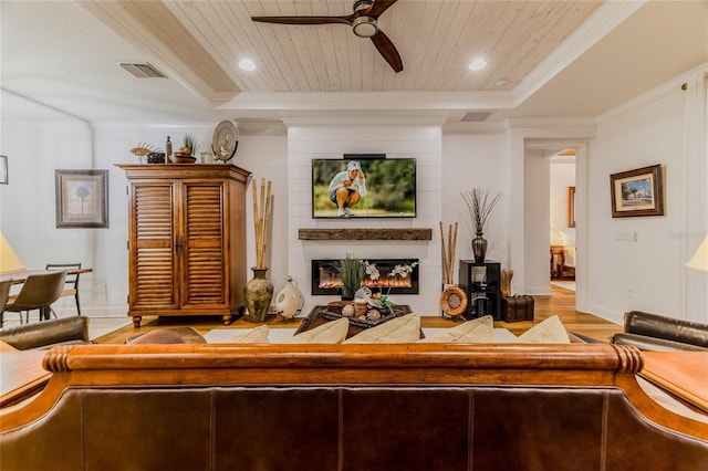 living room featuring a large fireplace, ornamental molding, ceiling fan, wood ceiling, and light hardwood / wood-style flooring