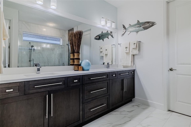 bathroom featuring a shower with door and vanity