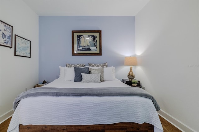 bedroom featuring dark hardwood / wood-style floors