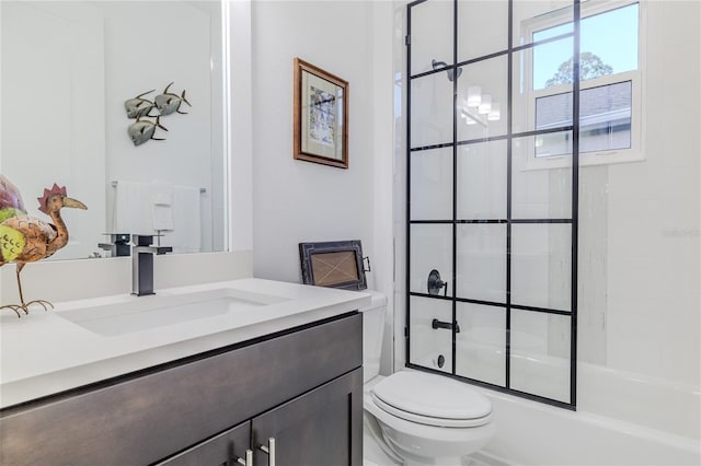 full bathroom with vanity, toilet, and bath / shower combo with glass door