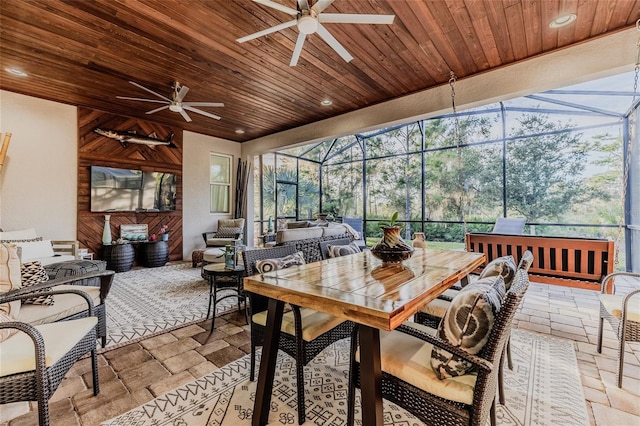 sunroom / solarium with wood ceiling and ceiling fan