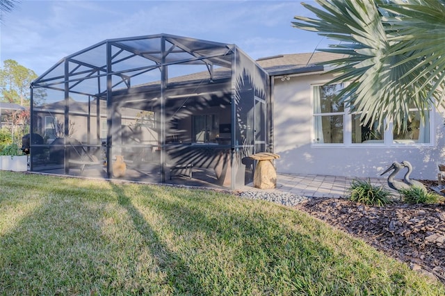 exterior space with a lanai and a patio area