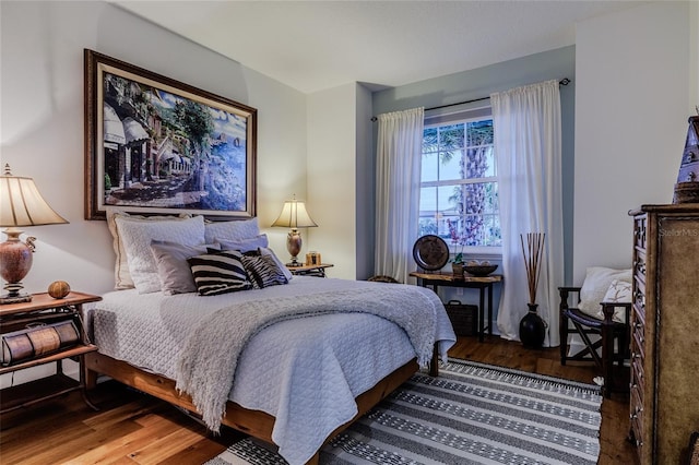 bedroom featuring dark wood-type flooring