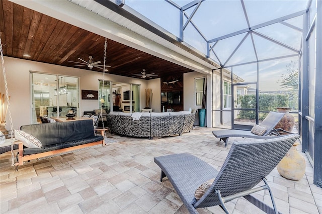 sunroom / solarium with wooden ceiling and ceiling fan