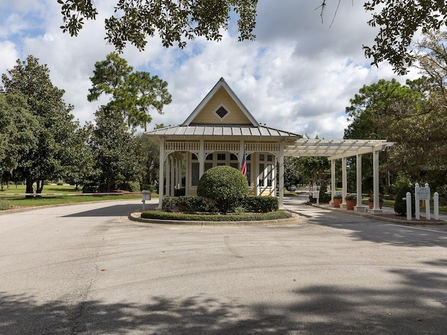 view of property's community featuring a pergola