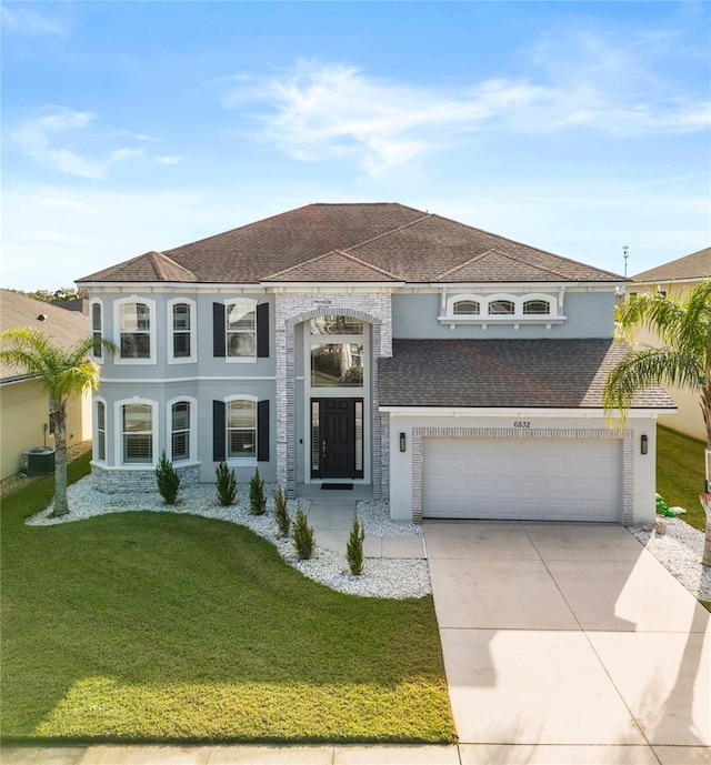 view of front of property featuring cooling unit and a front yard