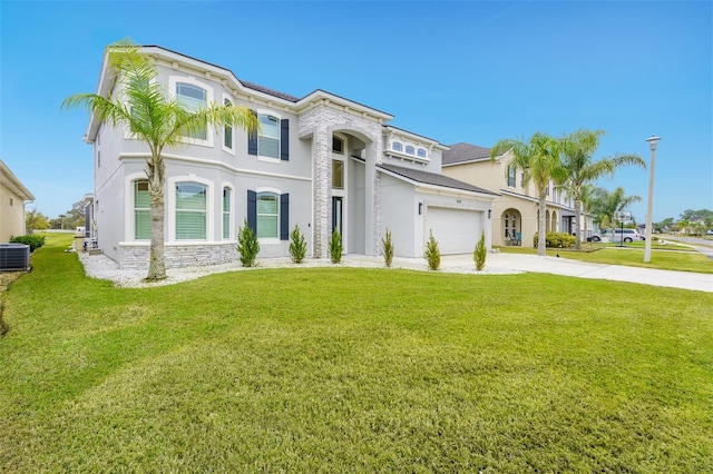 mediterranean / spanish-style home with central AC unit and a front lawn