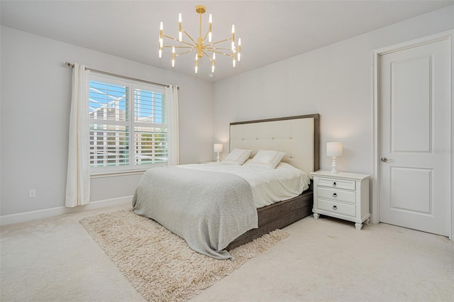 carpeted bedroom with a chandelier