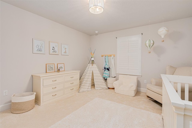 bedroom featuring light carpet