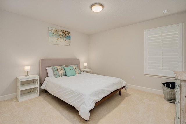 bedroom with light colored carpet