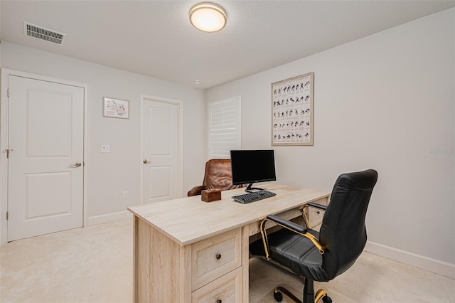 office space with light colored carpet