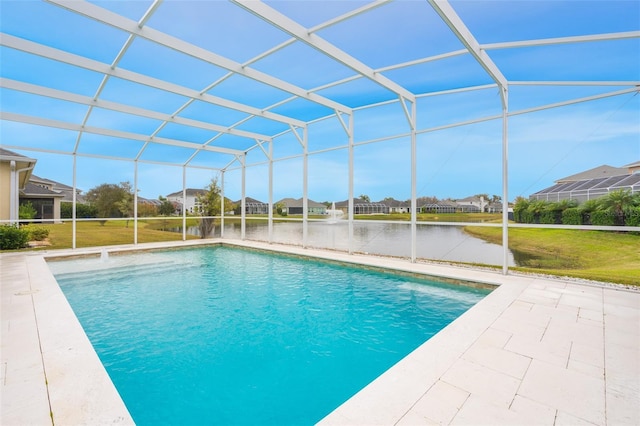 view of pool with a water view, a patio, a lanai, and a yard