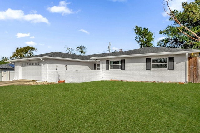 single story home with a garage and a front lawn