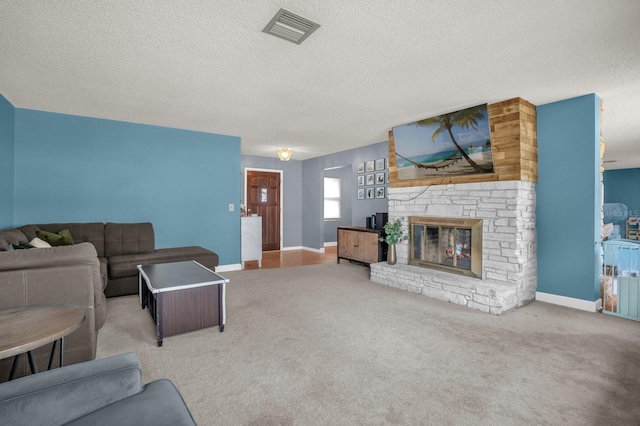 728 Vicksburg St, Deltona, FL 32725 - carpeted living room featuring a textured ceiling, a stone fireplace, and baseboards