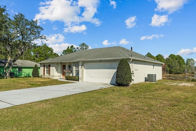 ranch-style house with cooling unit, a garage, and a front lawn