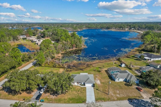 birds eye view of property with a water view