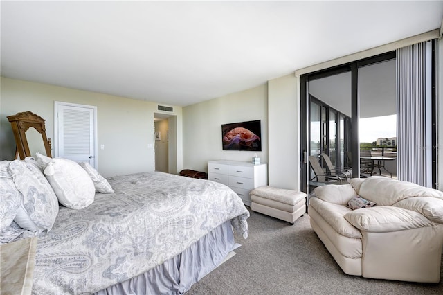 carpeted bedroom featuring access to exterior