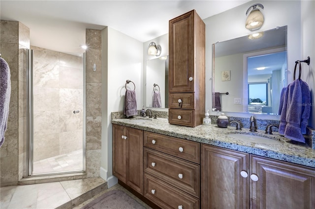 bathroom with tile patterned flooring, vanity, and a shower with shower door